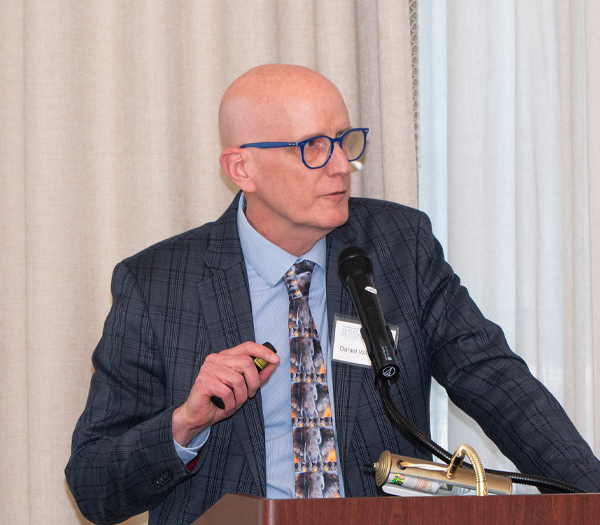 A speaker at a podium